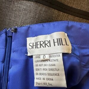 Sherri Hill beaded blue strapless dress.